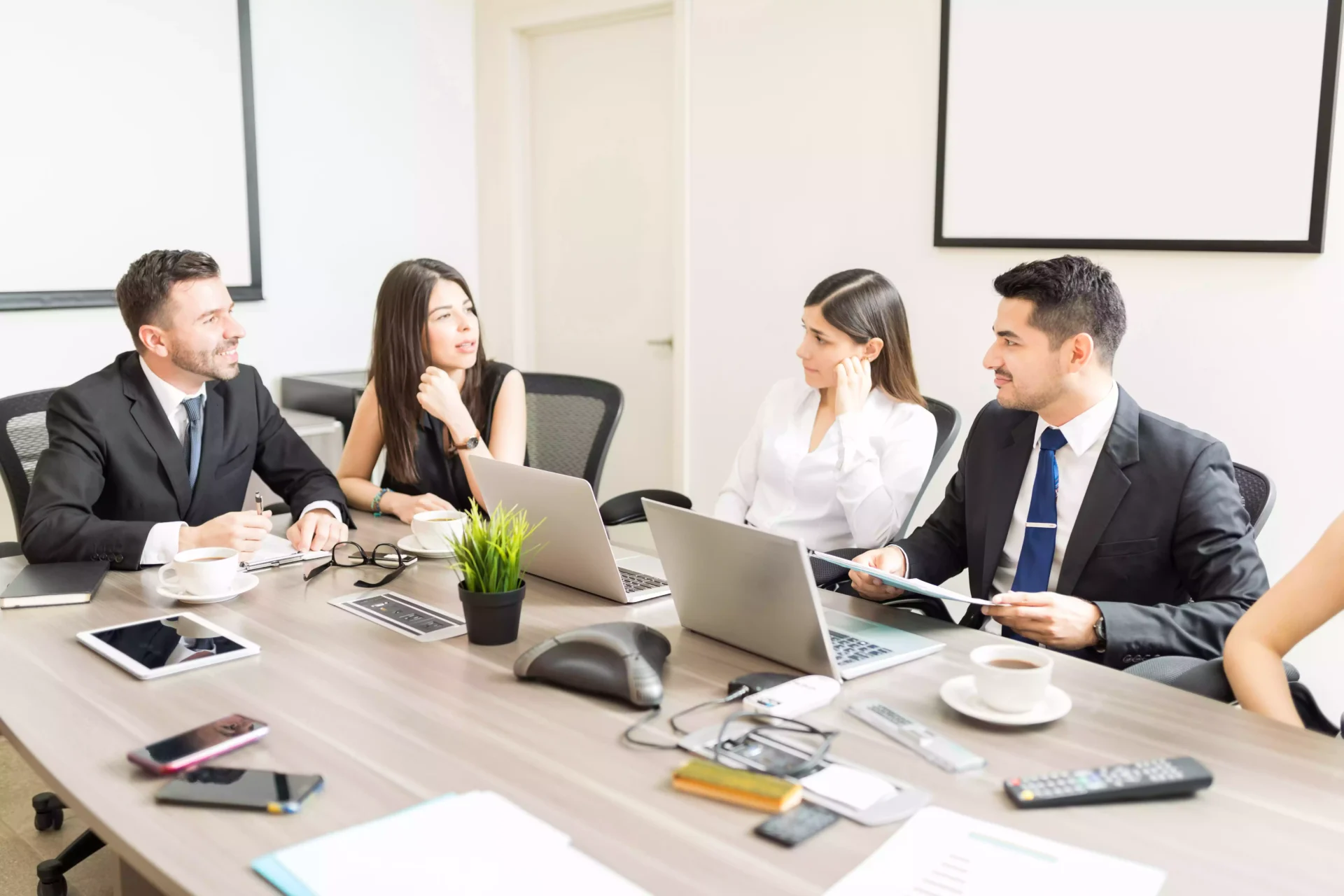 company-ceos-talking-merger-agreement-while-sitting-desk-office
